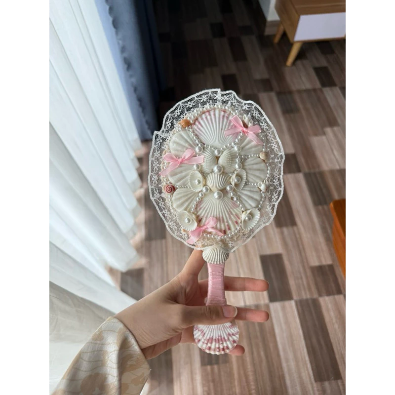 handmade seashell mirror with lace trim